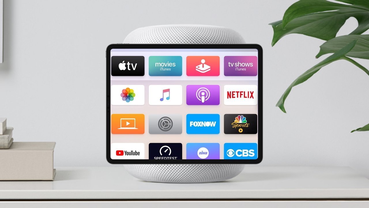 Display with popular app icons on a white stand next to stacked books and a green plant.