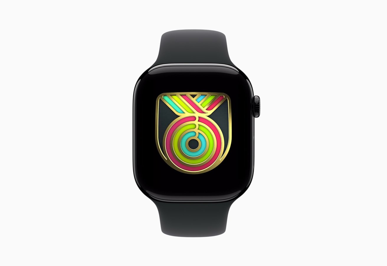 Black Apple Watch with colorful abstract circular and triangular pattern on display against a white background.